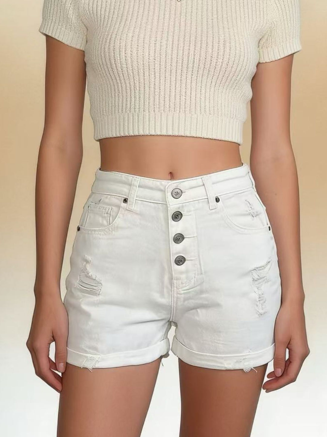 High-rise distressed denim shorts with button fly and rolled hem