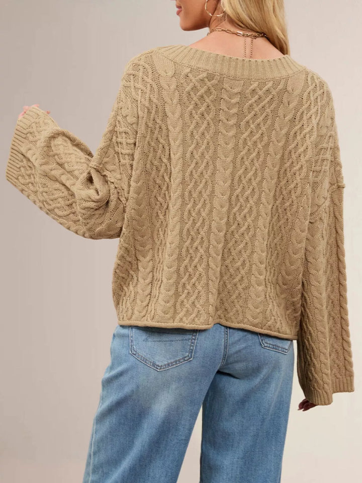 Cable knit button-front cardigan with patch pockets