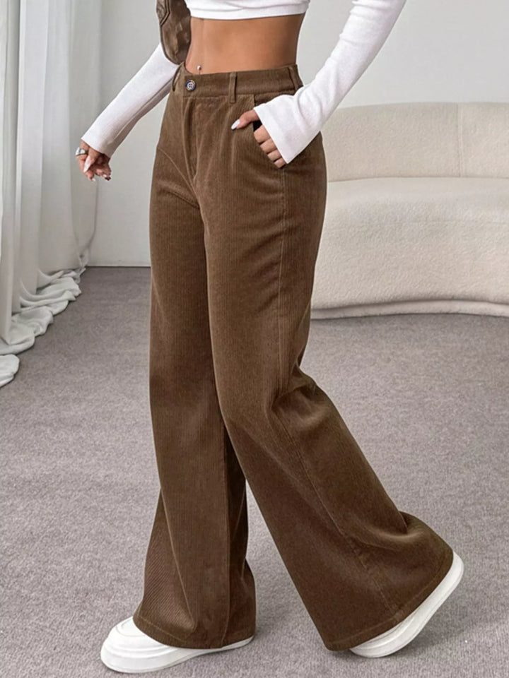 Wide-leg high-rise pants with button waist and deep pockets