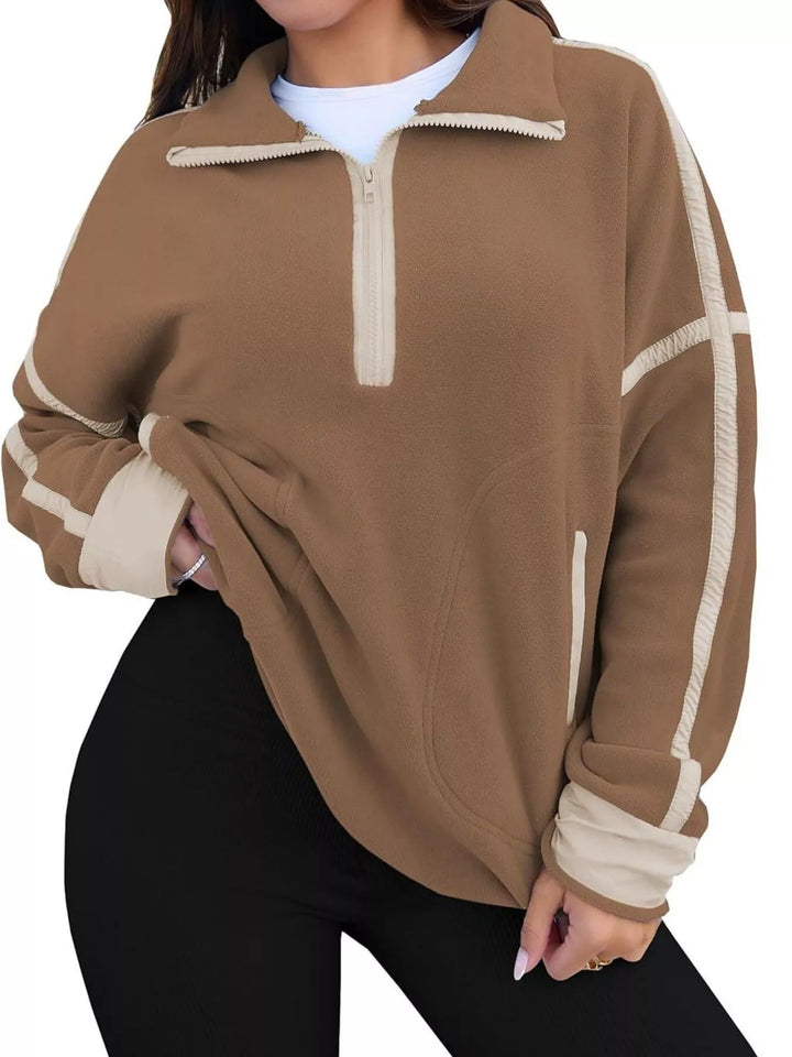 Half-zip fleece pullover with contrast trim and zip pockets