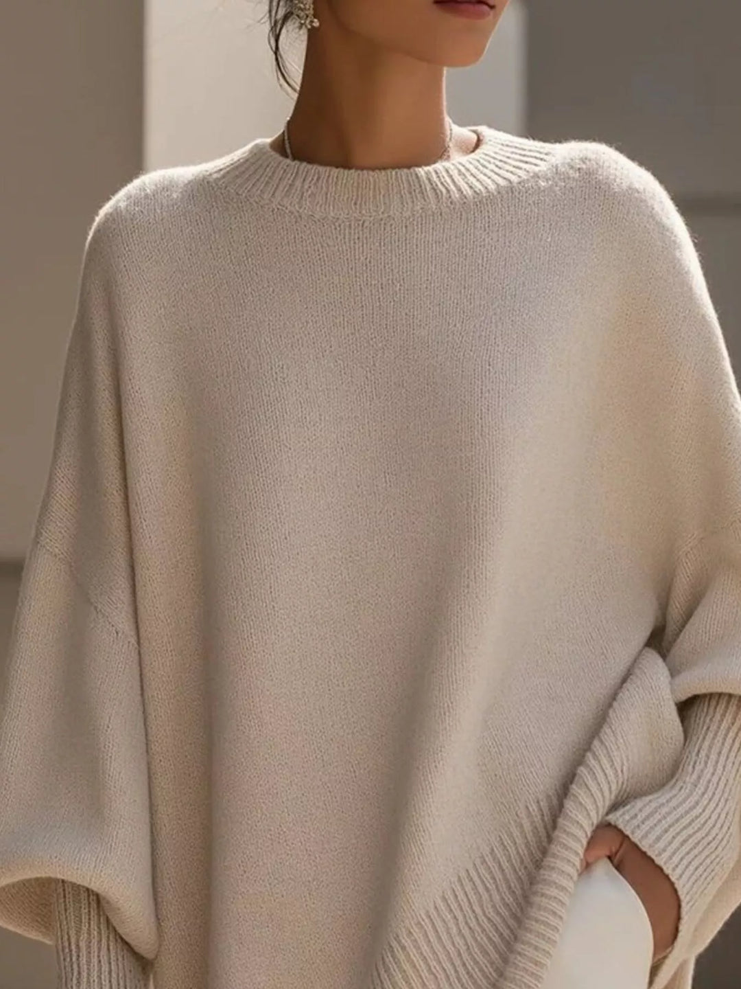 Batwing sleeve oversized sweater with asymmetric hem