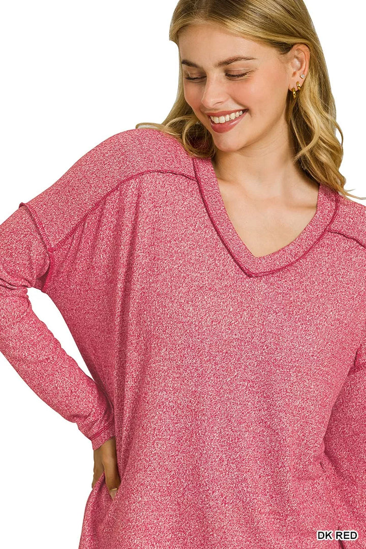 Exposed seam hi-low melange knit long sleeve top