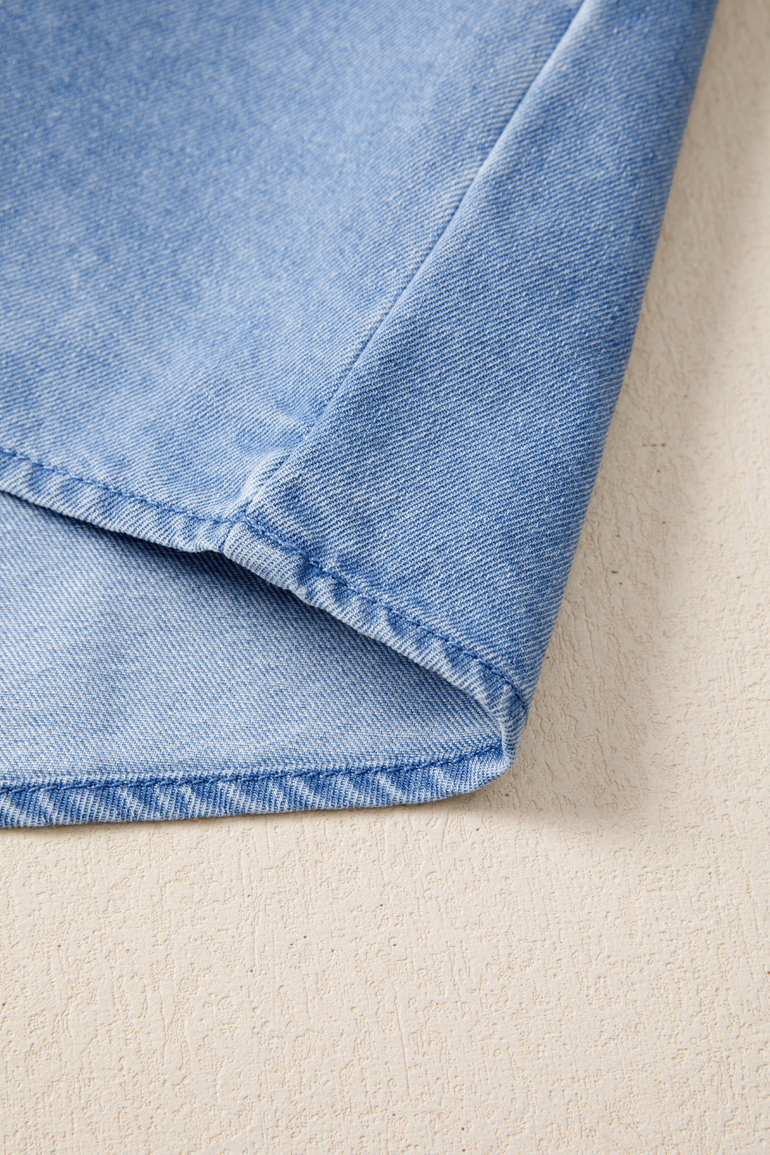 Frayed flutter sleeve denim top with frilled mock neck