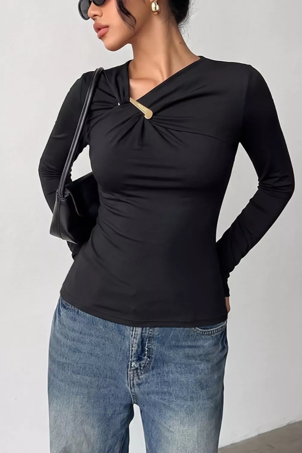 Asymmetric neckline ruched long sleeve top with gold bar