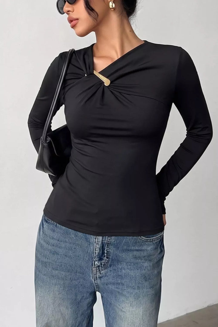 Asymmetric neckline ruched long sleeve top with gold bar