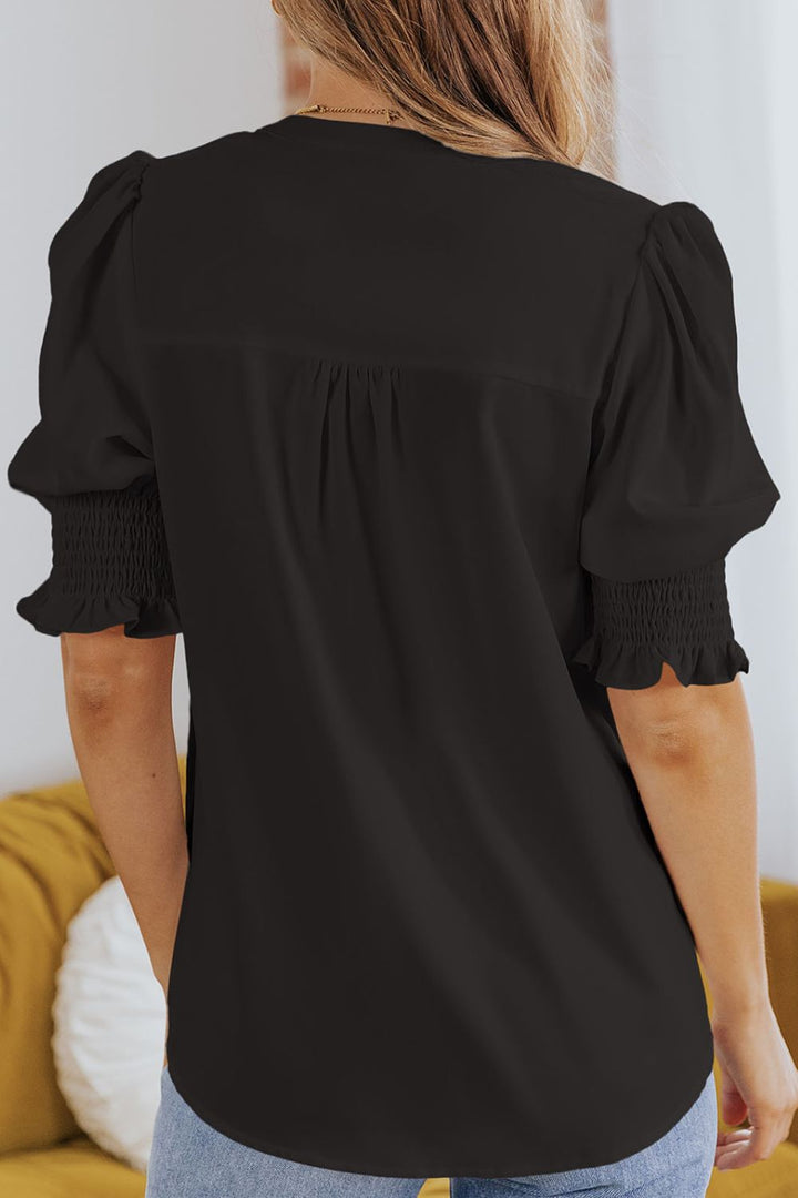 Notched neck blouse with smocked flounce sleeves