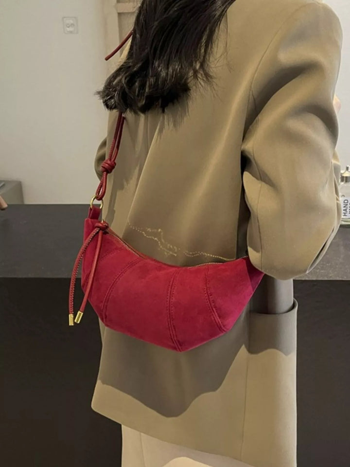 Red Crescent suede-look crossbody bag with knotted strap