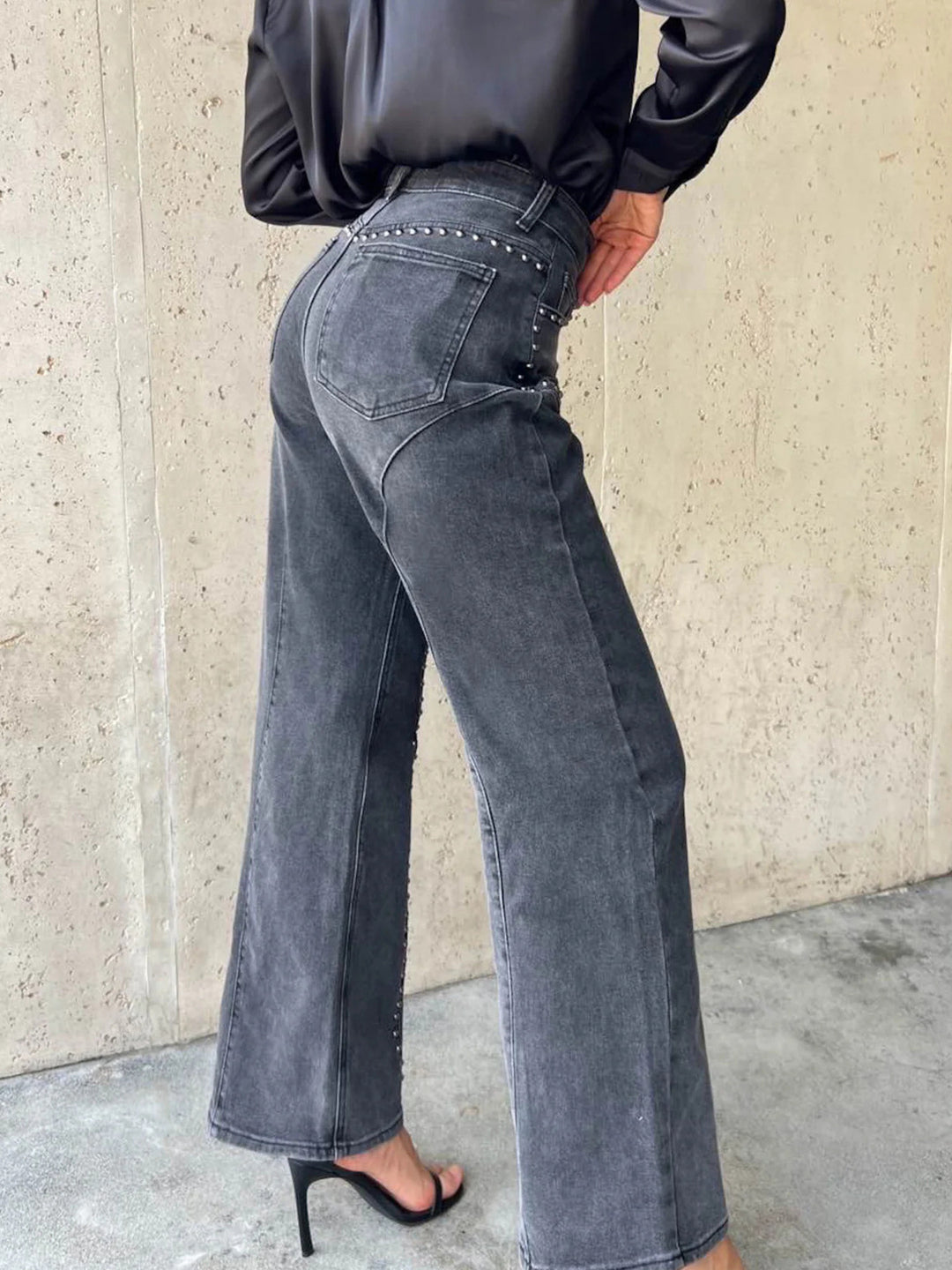 Studded high-rise wide-leg jeans with curved seam detail
