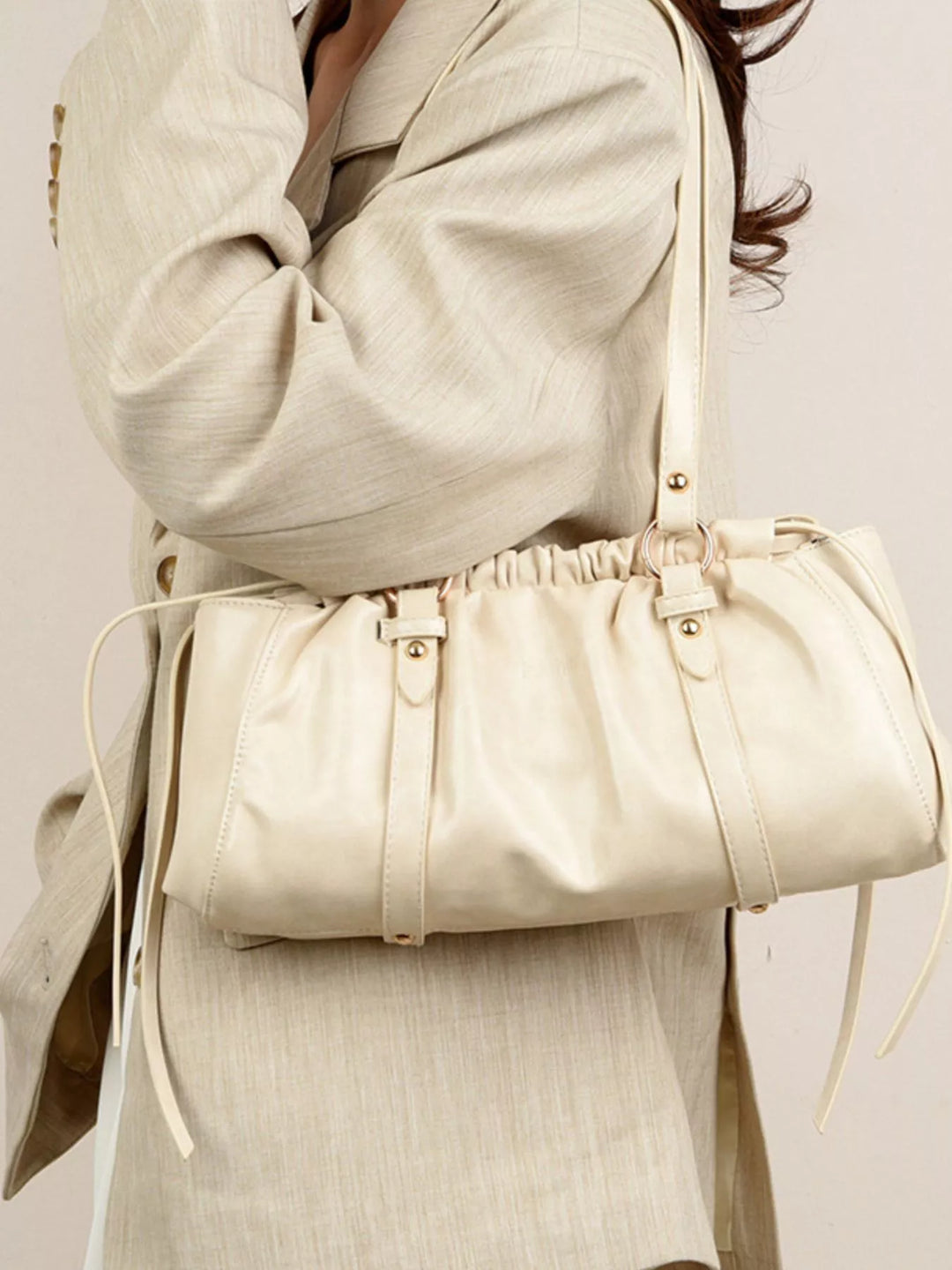 Ruched faux leather shoulder bag with O-ring straps
