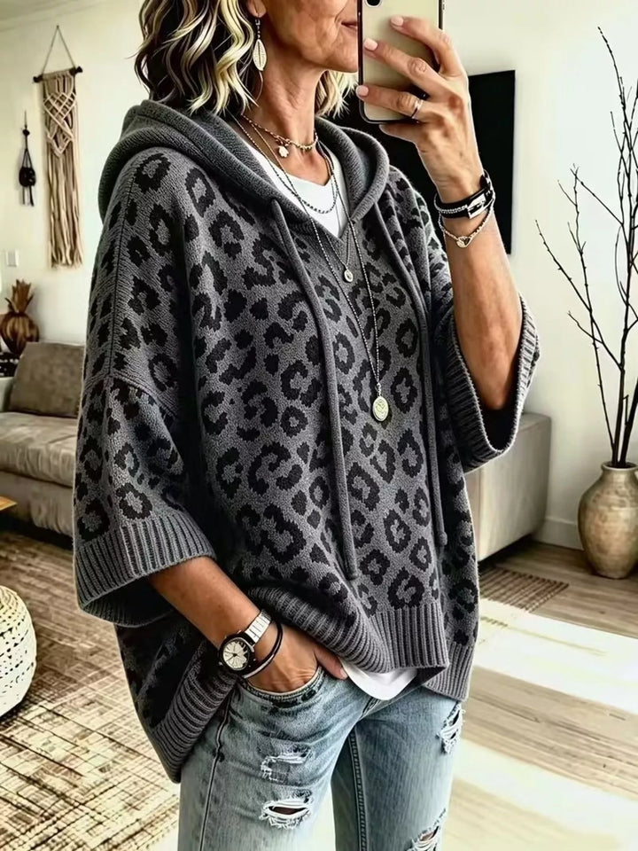 Leopard print drawstring hooded sweater with dolman sleeves
