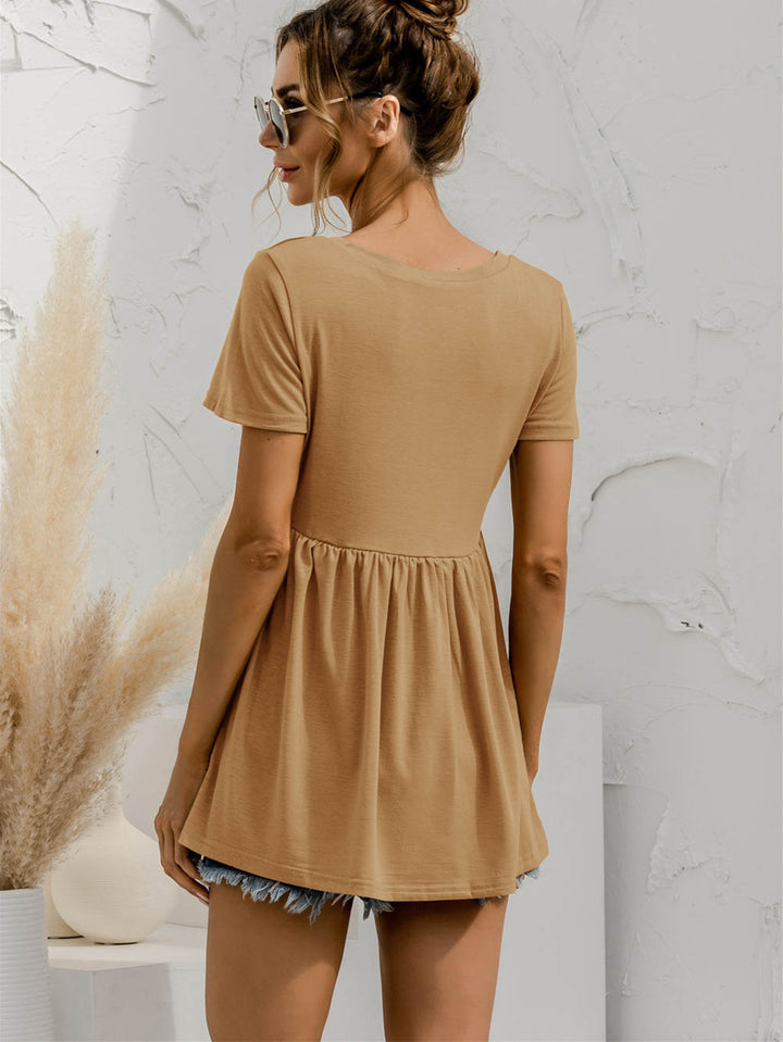 V-neck babydoll top with short sleeves and empire waist