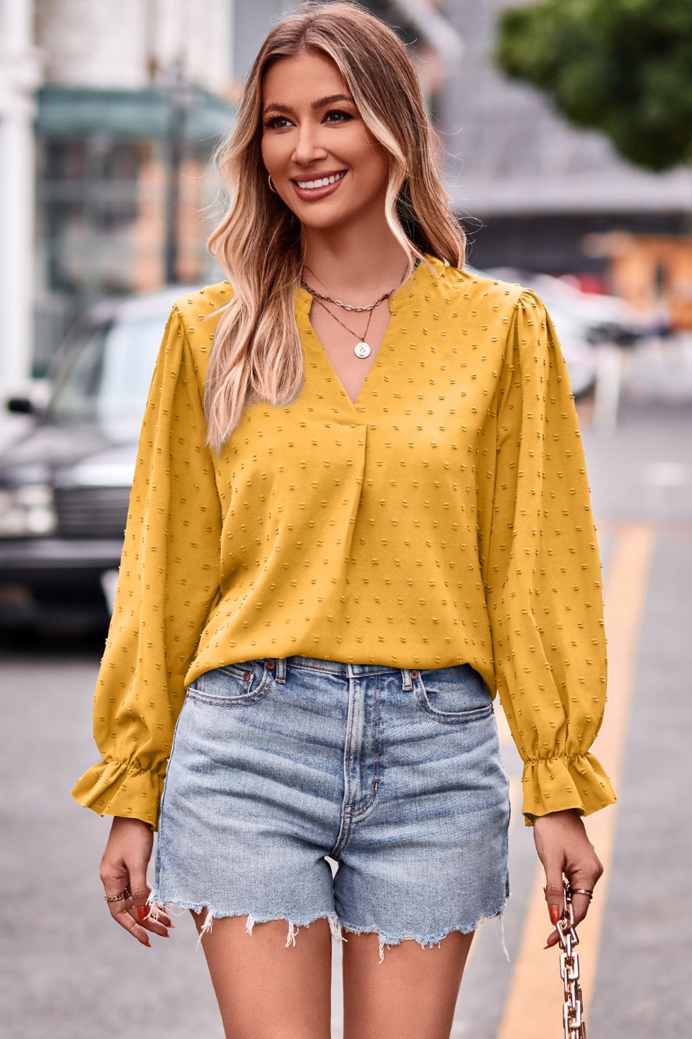 Gold Swiss dot notched neck blouse with flounce sleeves