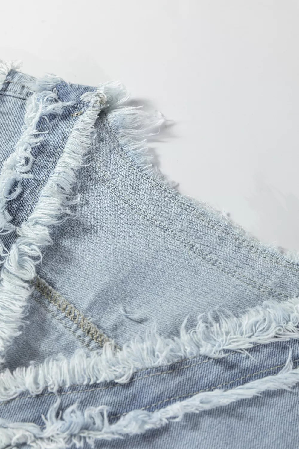 Frayed edge denim vest with snap flap pockets