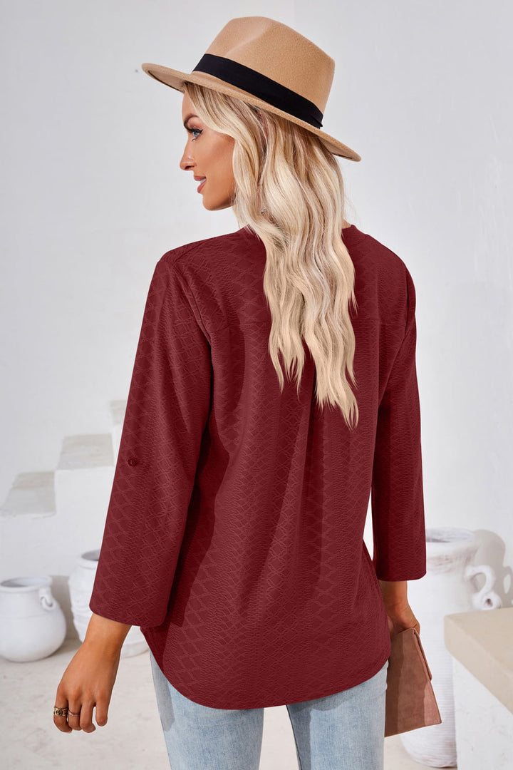 Textured split v-neck blouse with roll-tab sleeves