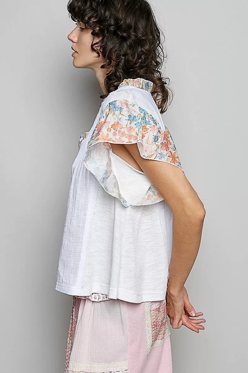 V-neck woven cotton blouse with floral ruffle cap sleeves