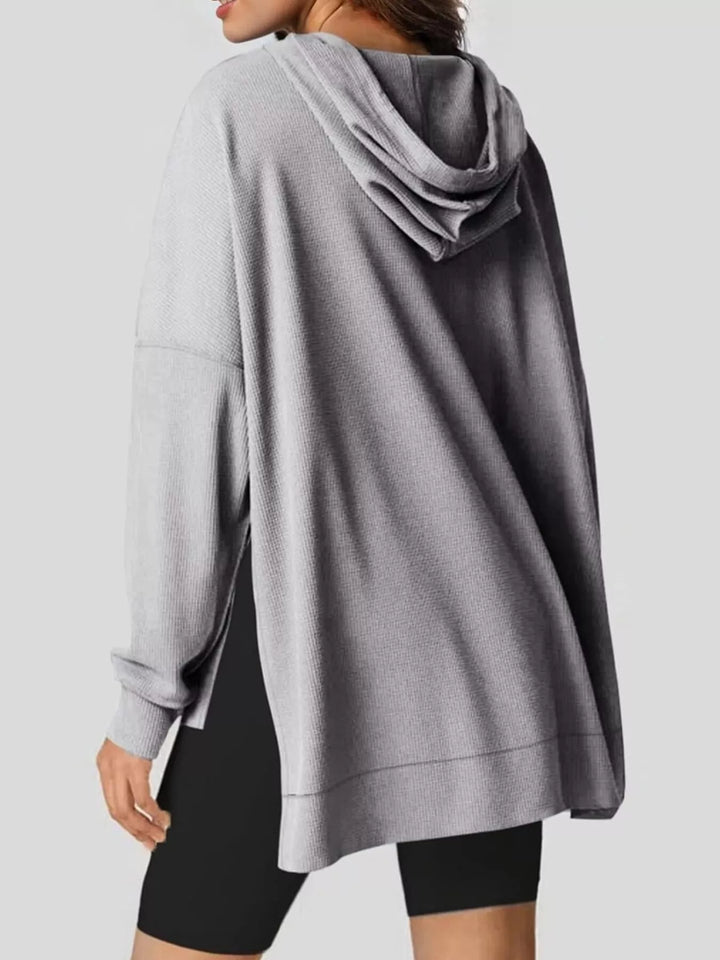 Oversized waffle-knit hoodie with side slits and front pocket