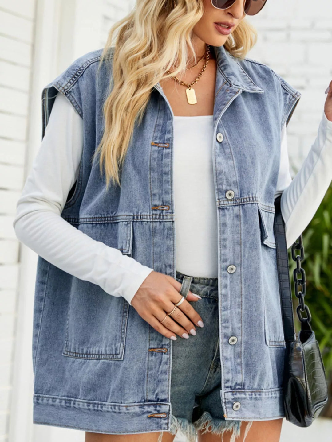 Sleeveless button-down denim vest jacket with patch pockets