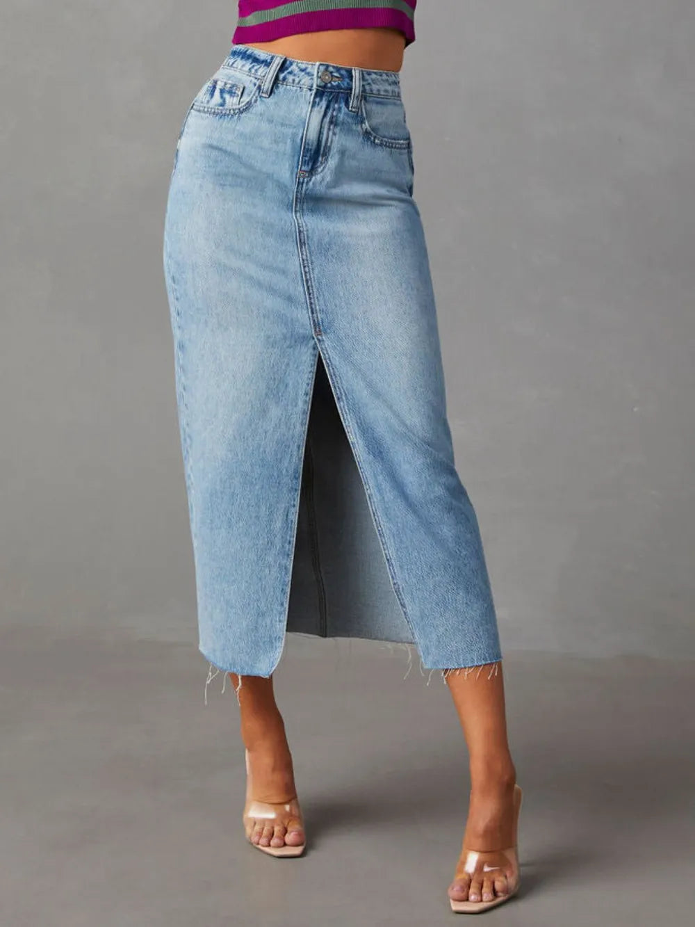High-rise denim midi skirt with raw hem and front slit