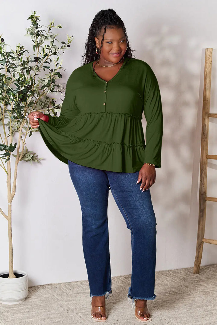 Half-button long sleeve blouse with tiered ruffle hem