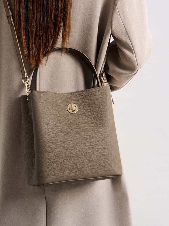 Mocha Pebbled faux leather bucket crossbody bag with twist lock