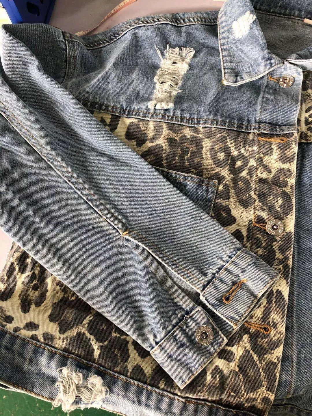 Distressed leopard-panel button-up denim jacket