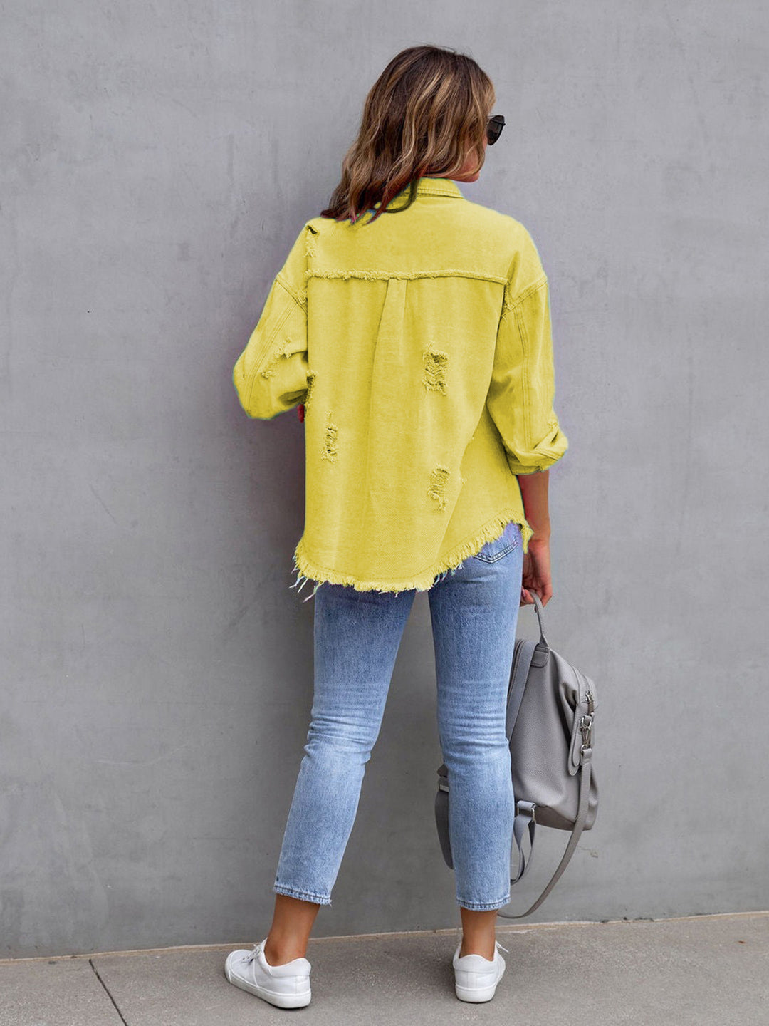 Distressed drop shoulder denim jacket with fringe hem