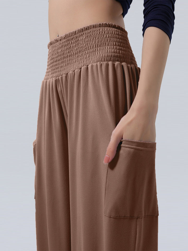 High-rise smocked harem pants with side pockets
