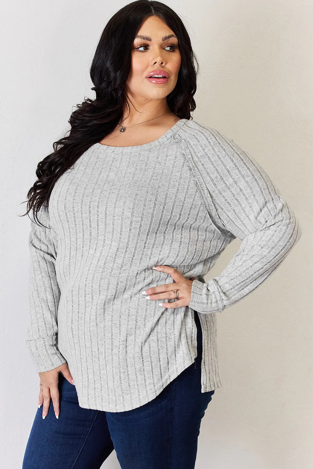 Ribbed knit round neck long sleeve top with side slits