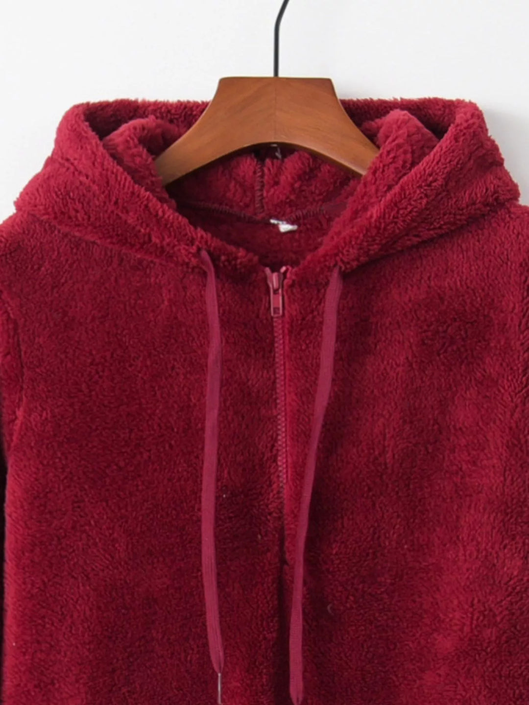 Plush half-zip fleece hoodie with drawstring hood and pockets