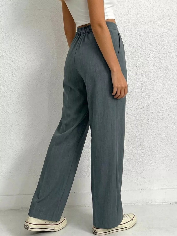 High-rise pleated wide-leg trousers with side pockets