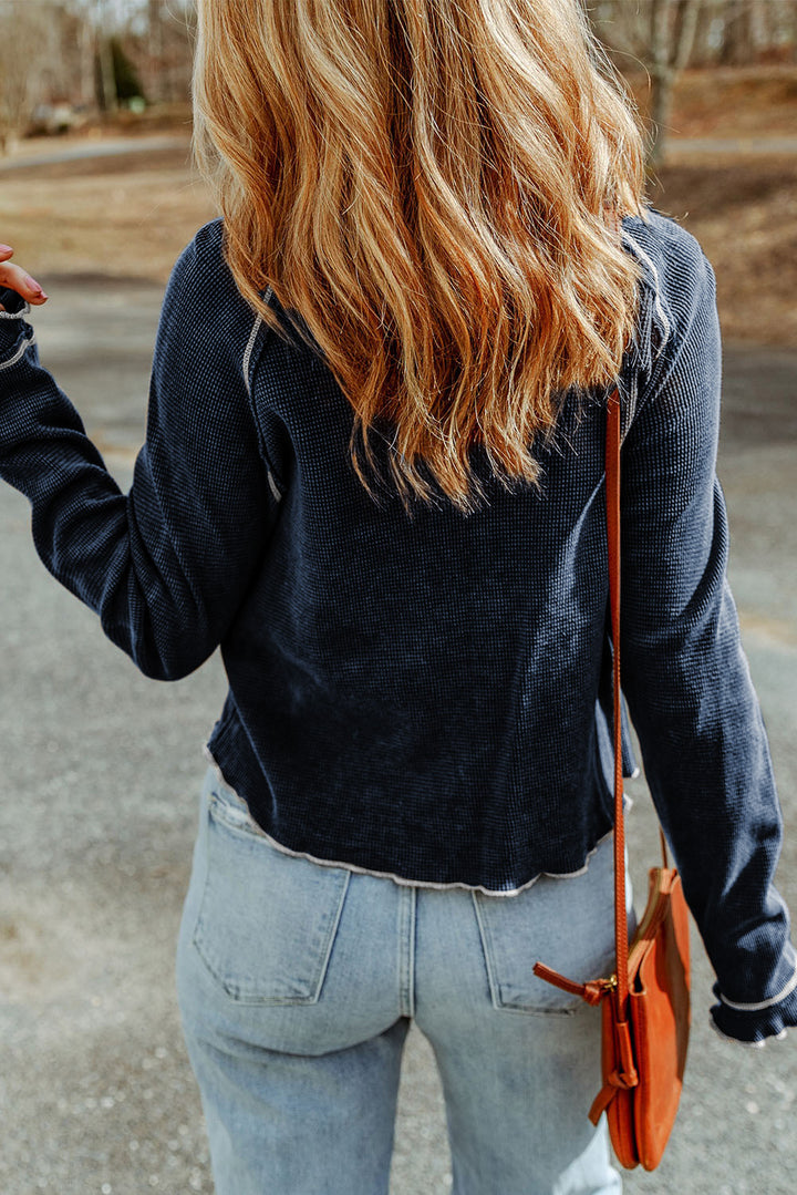 Waffle knit raglan sleeve top with ruffle cuffs