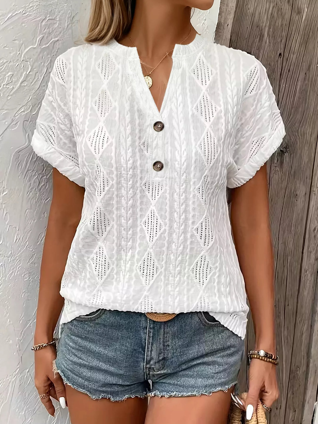 Diamond pointelle knit split-neck top with buttons