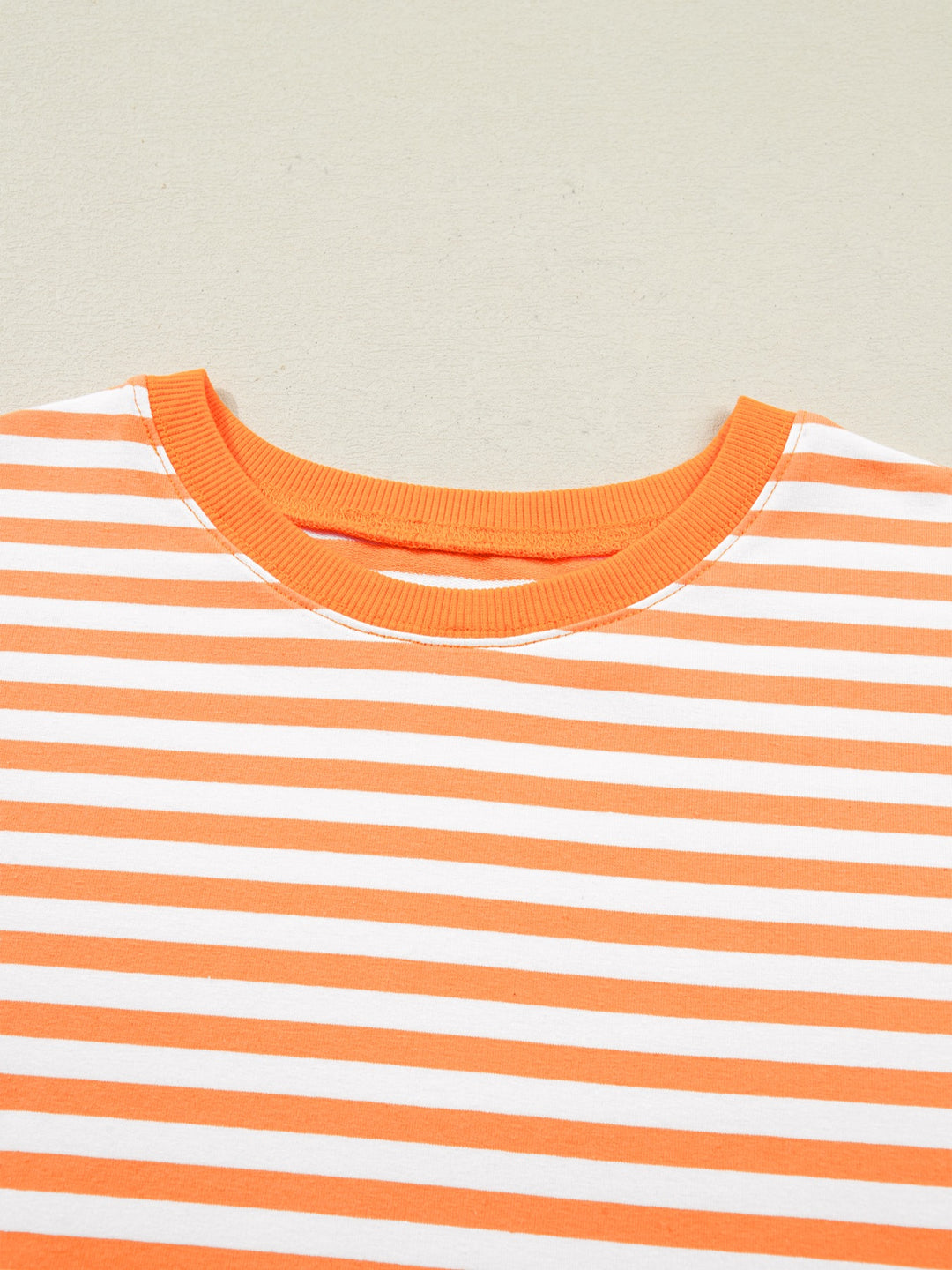 Striped exposed-seam 3/4 sleeve pullover top