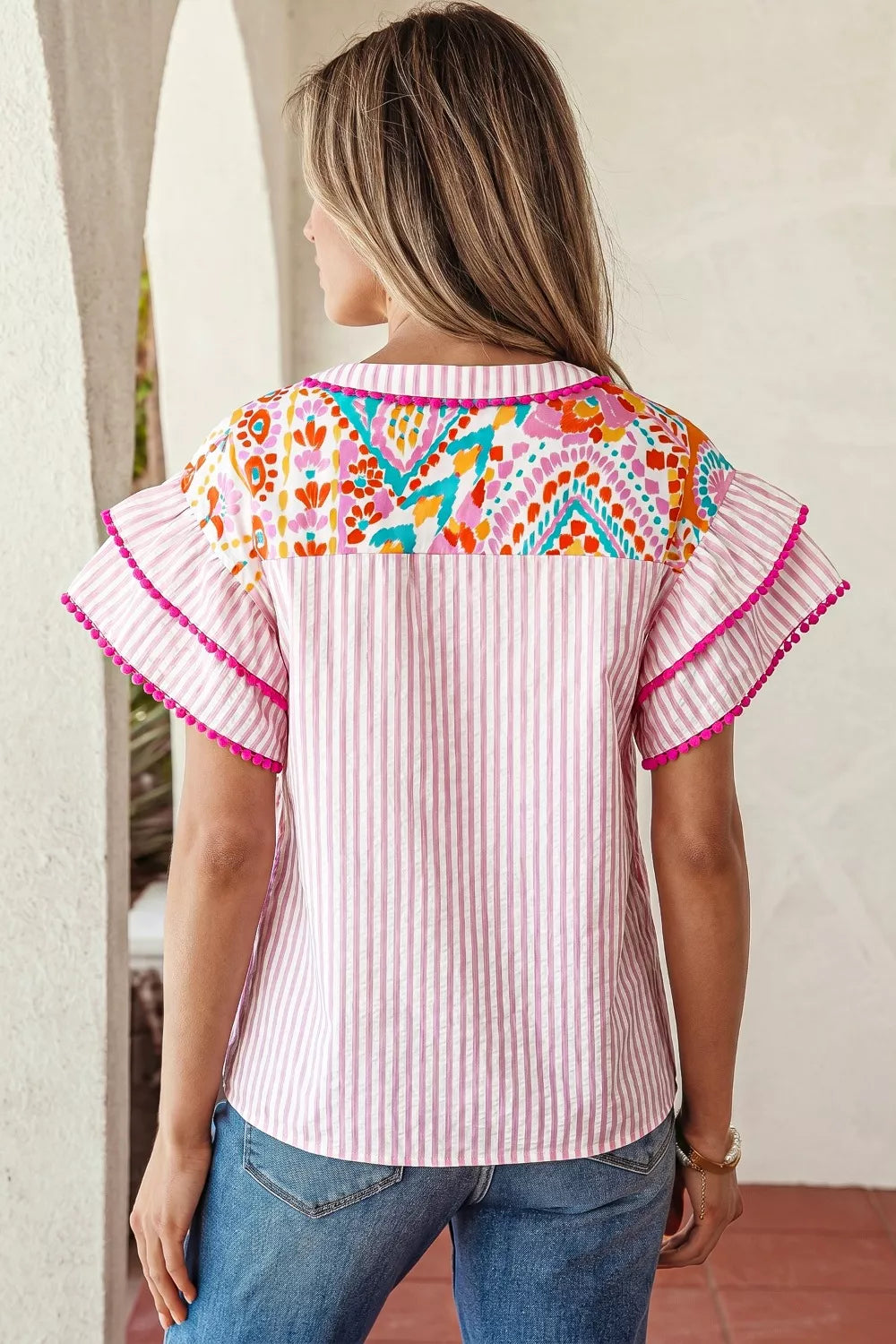 Patchwork mixed print blouse with ruffle sleeves and pom-pom trim