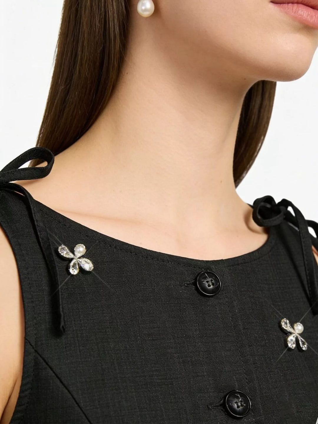 Structured button-front vest with rhinestone flower embellishments