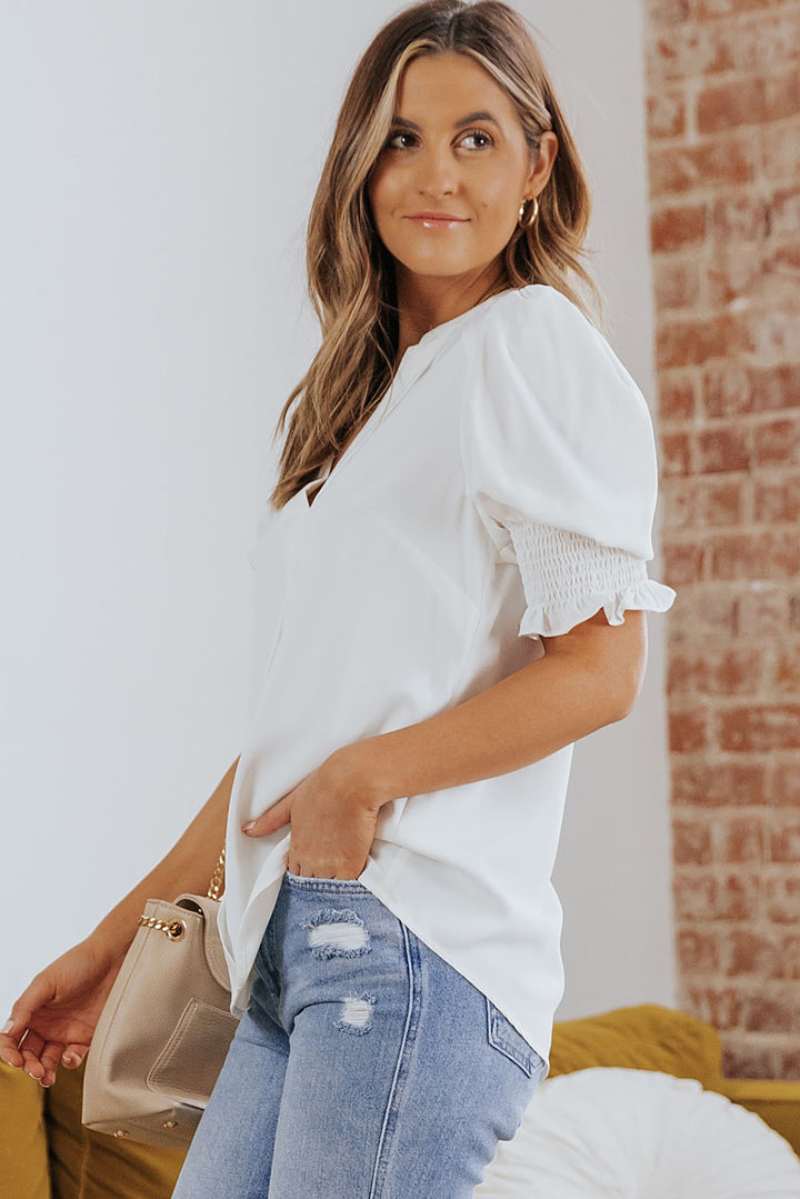 Notched neck blouse with smocked flounce sleeves