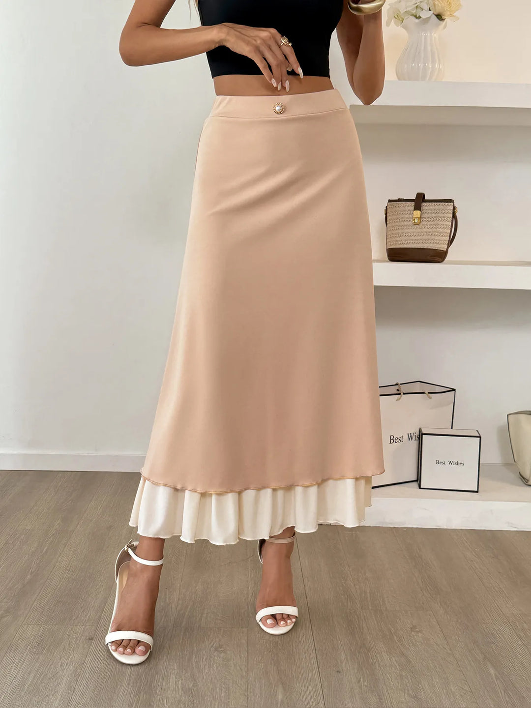Layered A-line midi skirt with contrast ruffle hem