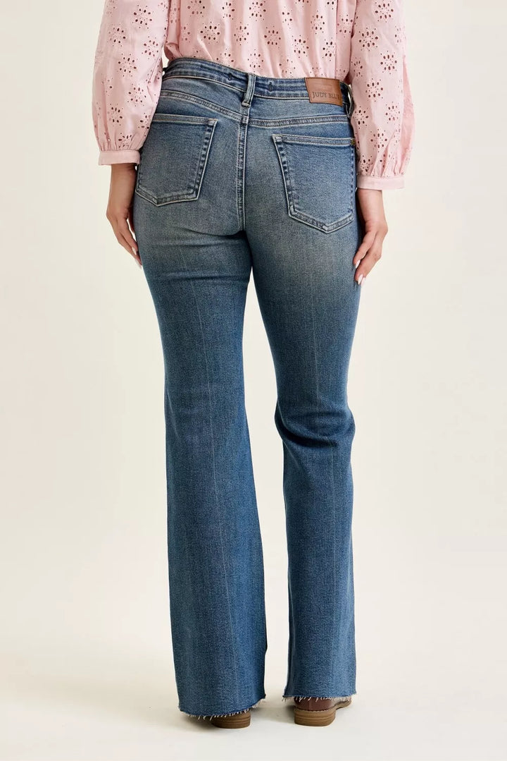 Judy Blue mid-rise flare jeans with front flap pockets and raw hem