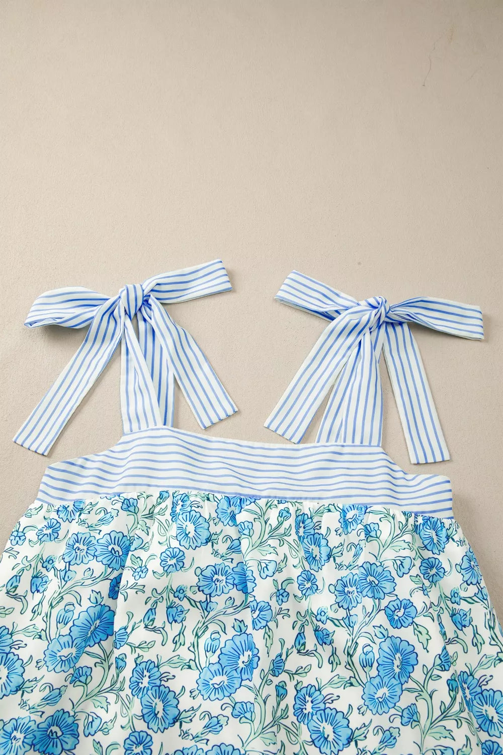 Floral babydoll mini dress with striped tie straps