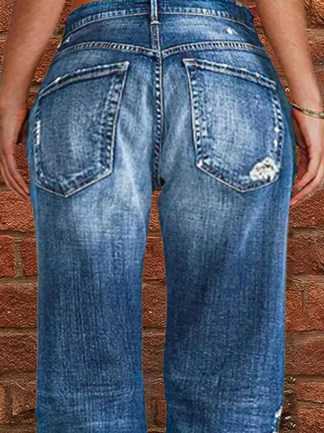 Distressed straight-leg jeans with raw frayed hem