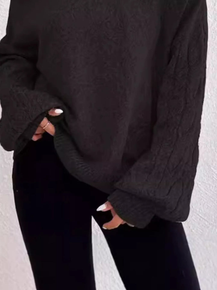 Cold-shoulder cable-knit turtleneck sweater