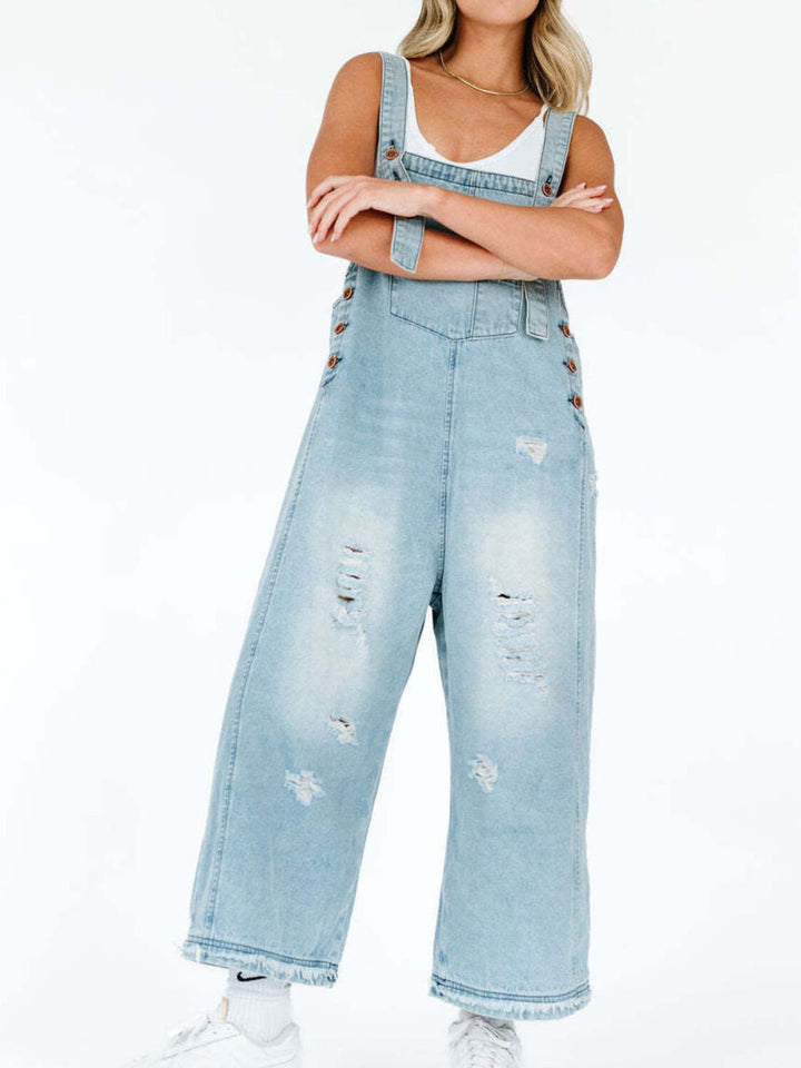 Distressed wide leg denim overalls with adjustable straps