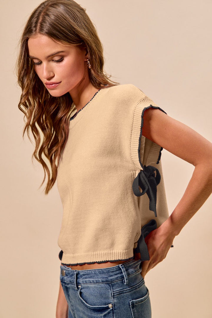 Dolman knit sweater top with contrast trim and side ribbon ties