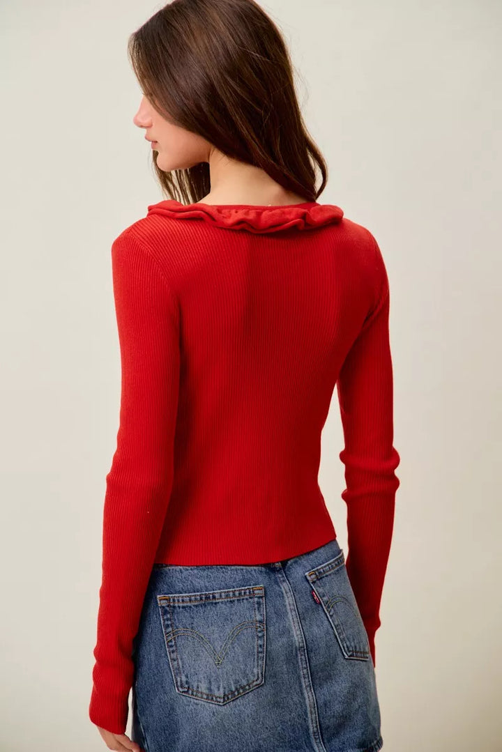 Ribbed knit cardigan with cascade ruffle trim