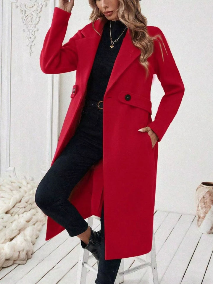 Longline notch lapel coat with single-button waist tab
