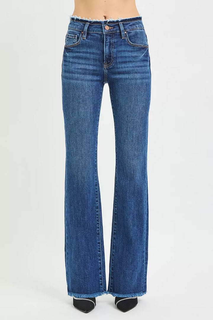 Mid-rise bootcut jeans with frayed waistband and raw hem