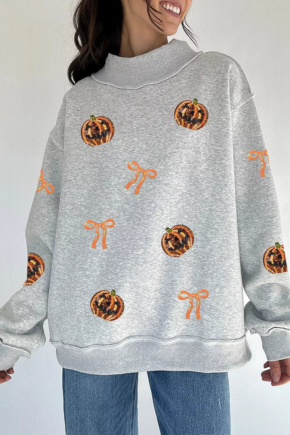 Light Gray Sequin pumpkin and bow exposed seam Halloween sweatshirt