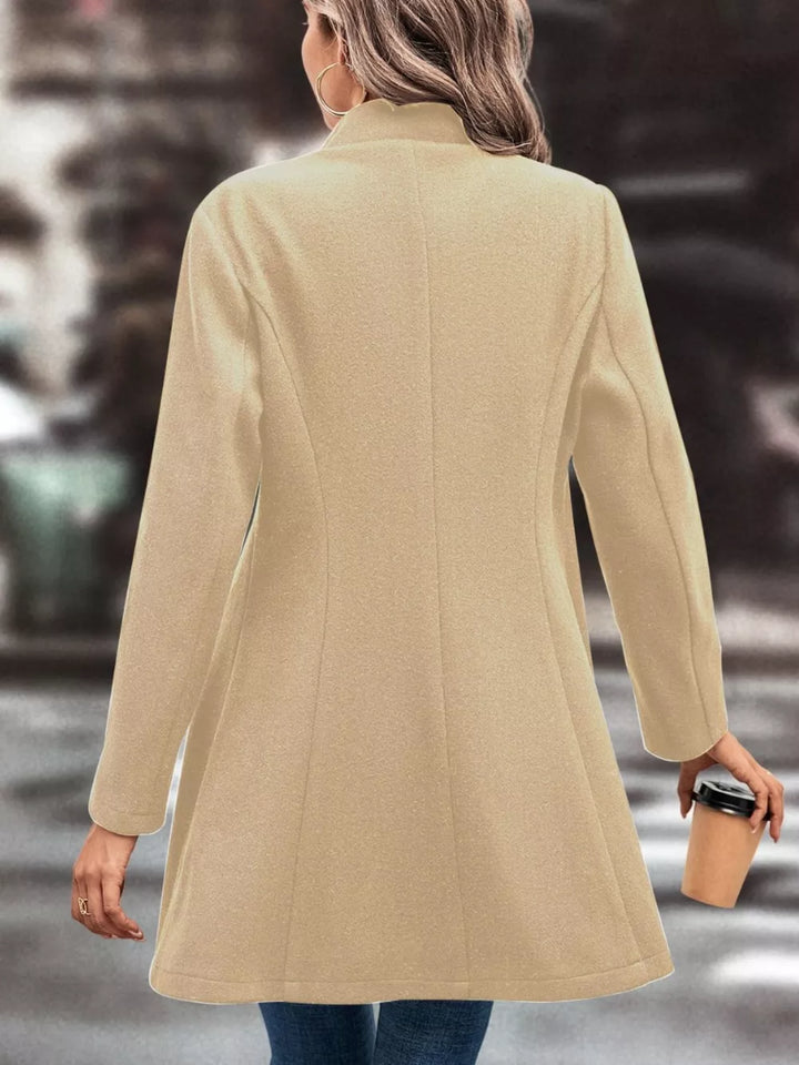 Button-front longline coat with notched lapel and flared hem