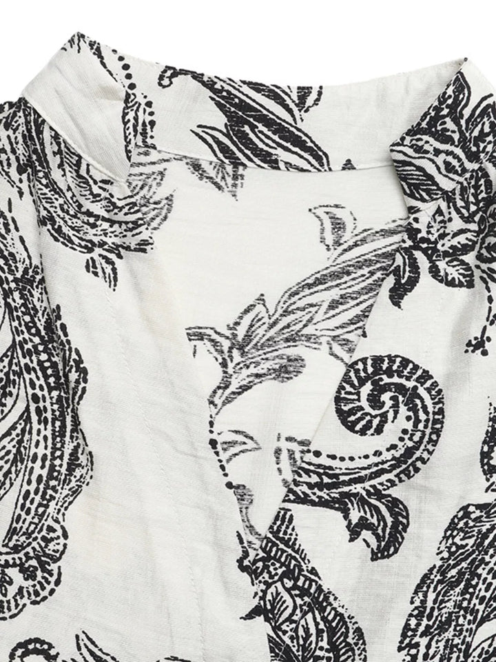 Notched neckline paisley tiered maxi dress with flutter sleeves