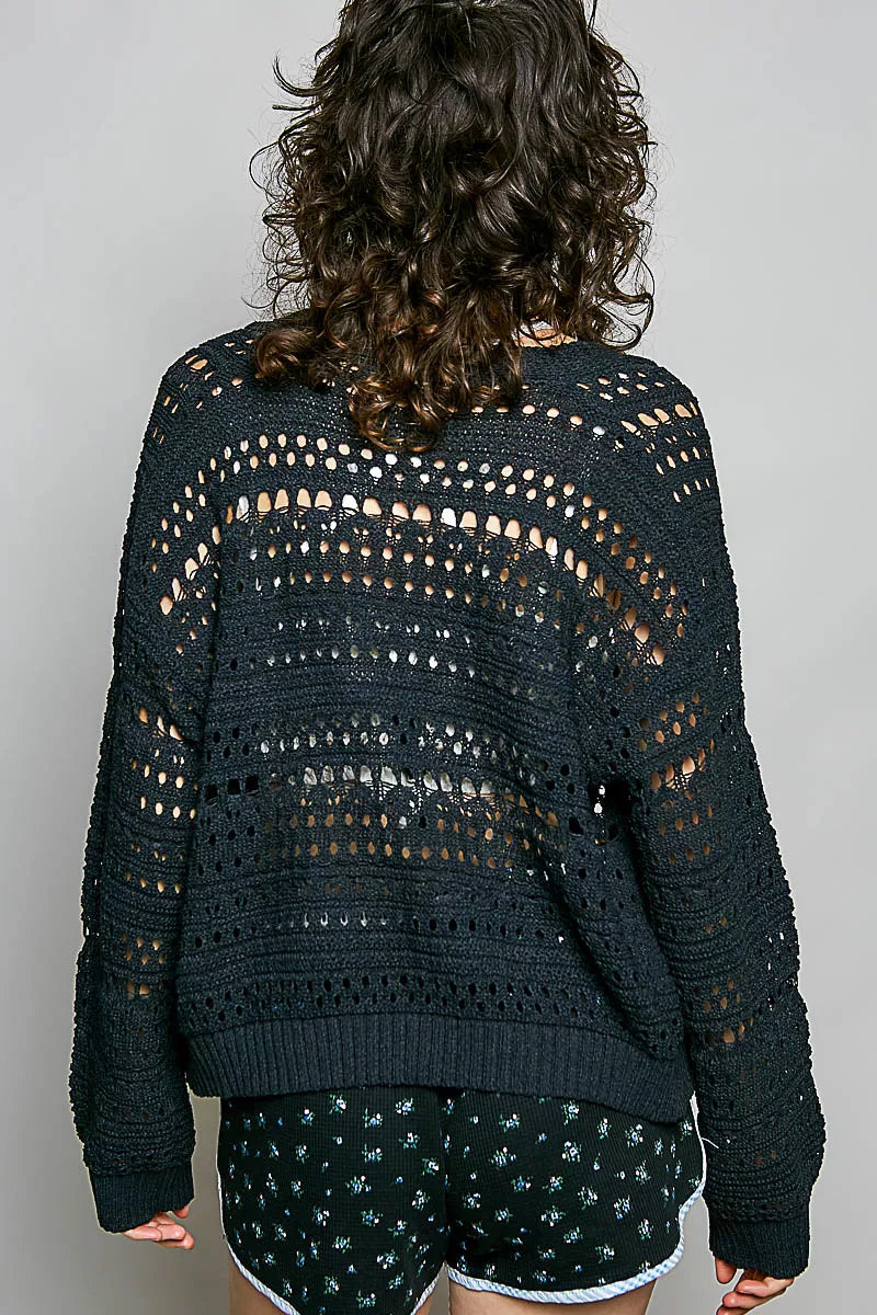 Open-knit cropped cardigan with 3D floral button closure